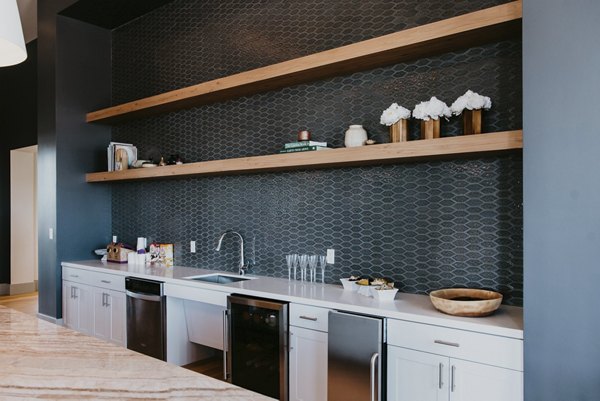 Elegant clubhouse with modern dÃ©cor at Tanager Apartments, featuring spacious lounge areas and a stylish interior design
