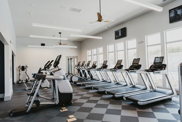 Modern fitness center with state-of-the-art equipment at Tanager Apartments