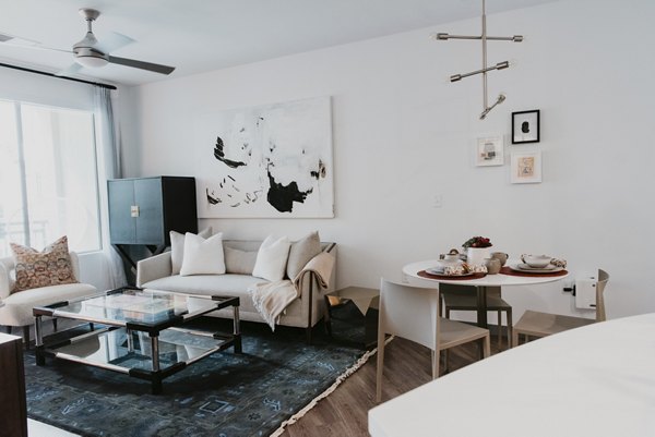 Contemporary living room with stylish decor at Tanager Apartments, offering elegance and comfort in a luxury apartment setting