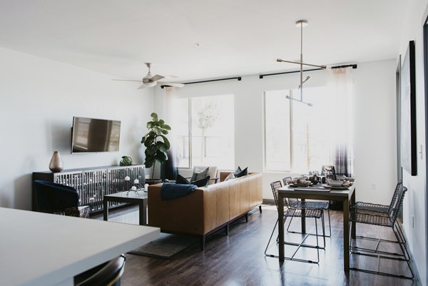 Stylish living room with modern furnishings at Tanager Apartments, a Greystar luxury property