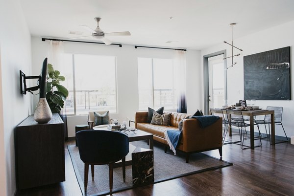 Bright living room with modern furnishings in Tanager Apartments