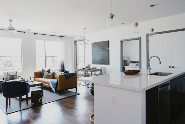 Tanager Apartments: Modern living room with stylish decor and natural light