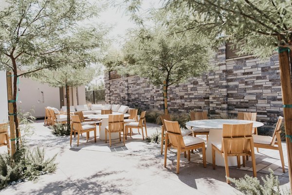 Charming courtyard with lush greenery at Tanager Apartments
