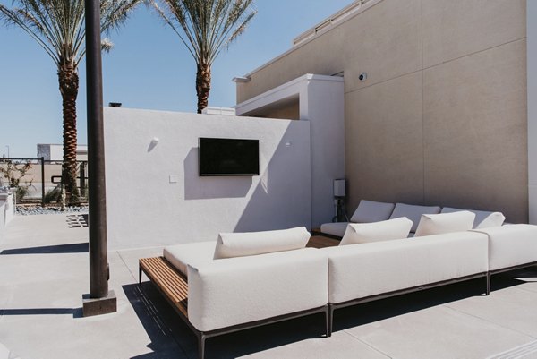 Tanager Apartments: Tranquil courtyard with lush landscaping and seating areas, perfect for relaxation and socializing