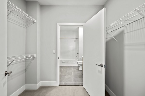 Arris Apartments: Walk-in closet with ample storage and sleek design