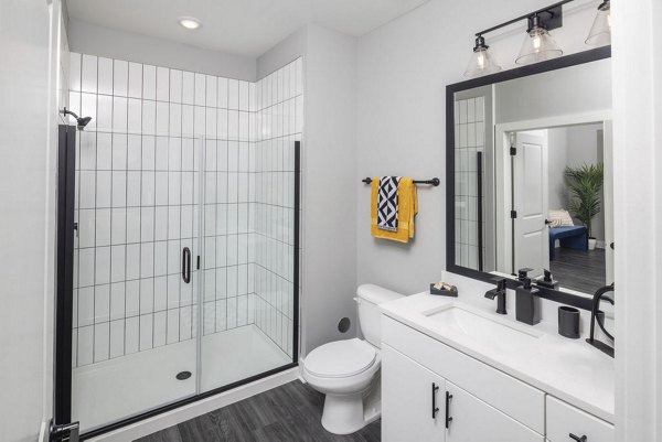 Broadstone Craft Apartments: Sleek bathroom with modern fixtures and marble countertops