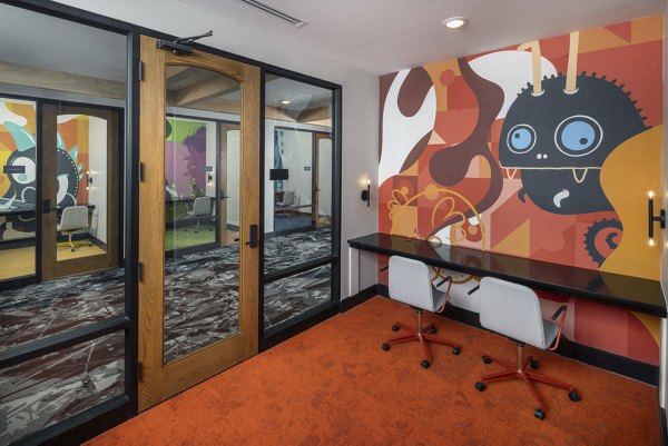Clubhouse featuring contemporary design and cozy seating at Broadstone Craft Apartments