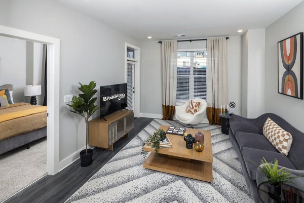 Cozy living room with modern decor in Broadstone Craft Apartments, offering luxury living with spacious layouts and premium finishes