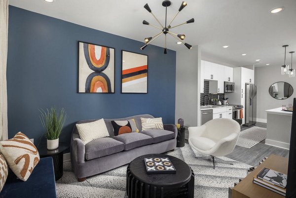 Spacious living room with modern furnishings at Broadstone Craft Apartments