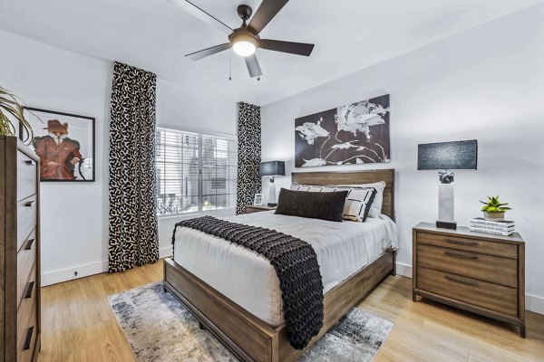 Cozy bedroom with modern decor at Hideaway North Scottsdale Apartments
