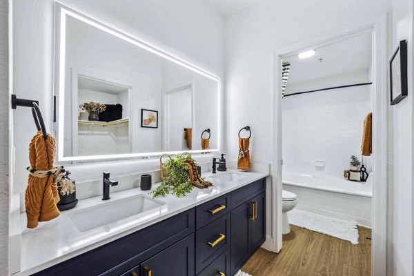 Bathroom with dual sinks and modern fixtures at Hideaway North Scottsdale Apartments, offering luxury living in a prime location