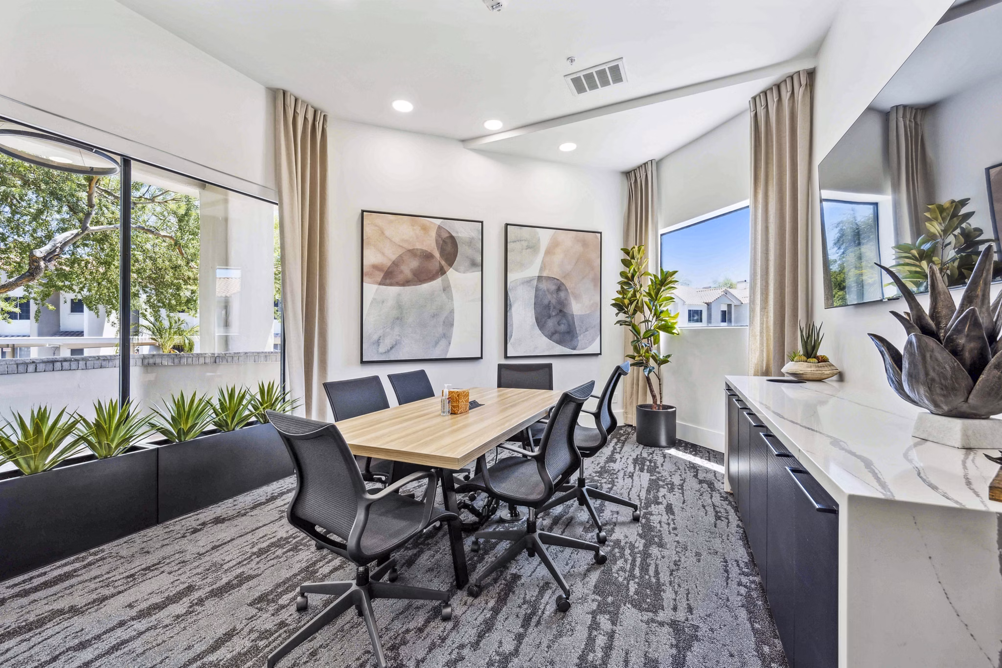 Elegant clubhouse at Hideaway North Scottsdale Apartments featuring modern design and cozy seating areas