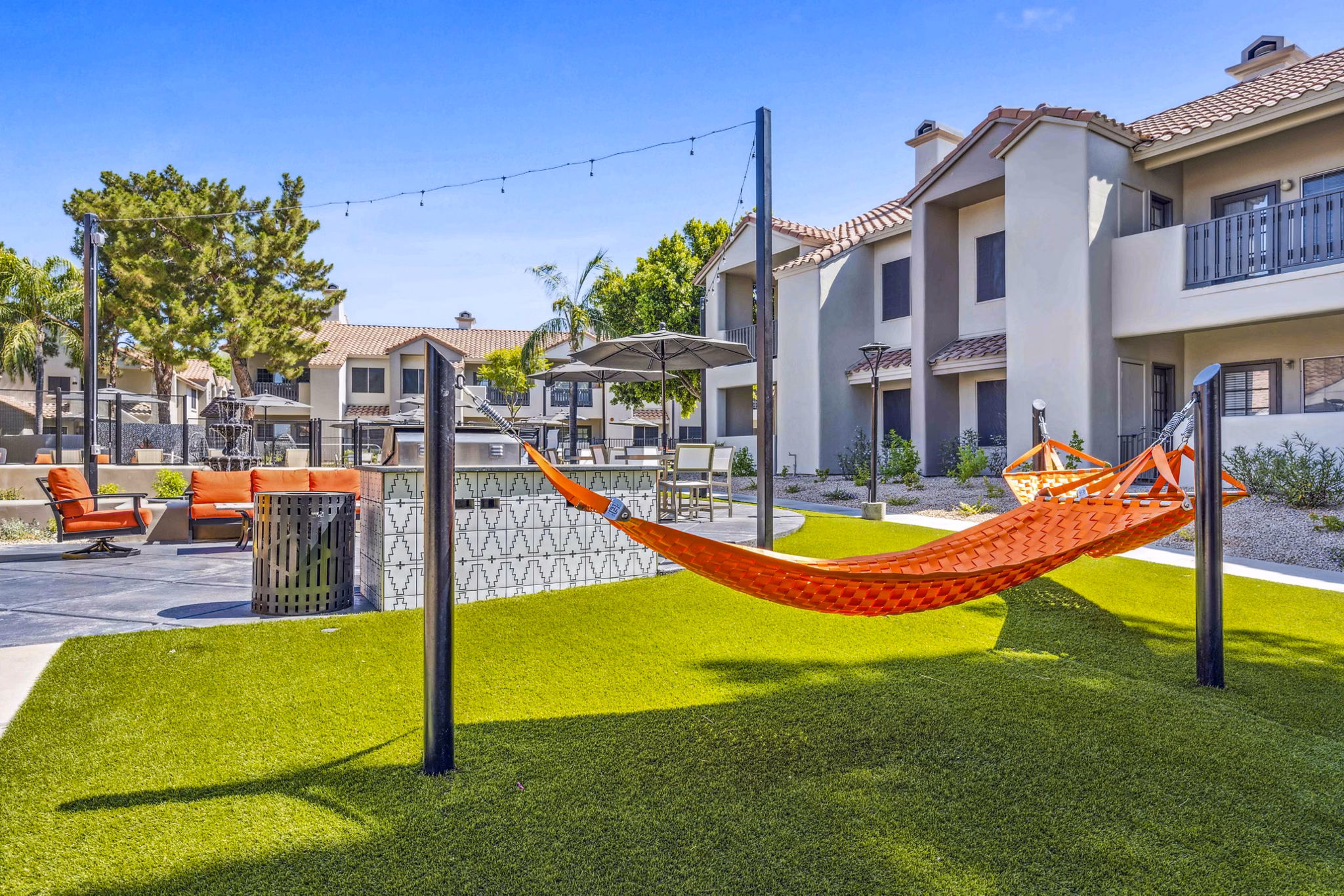 Relaxing grill area with seating at Hideaway North Scottsdale Apartments