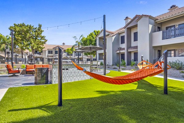 Relaxing grill area with seating at Hideaway North Scottsdale Apartments