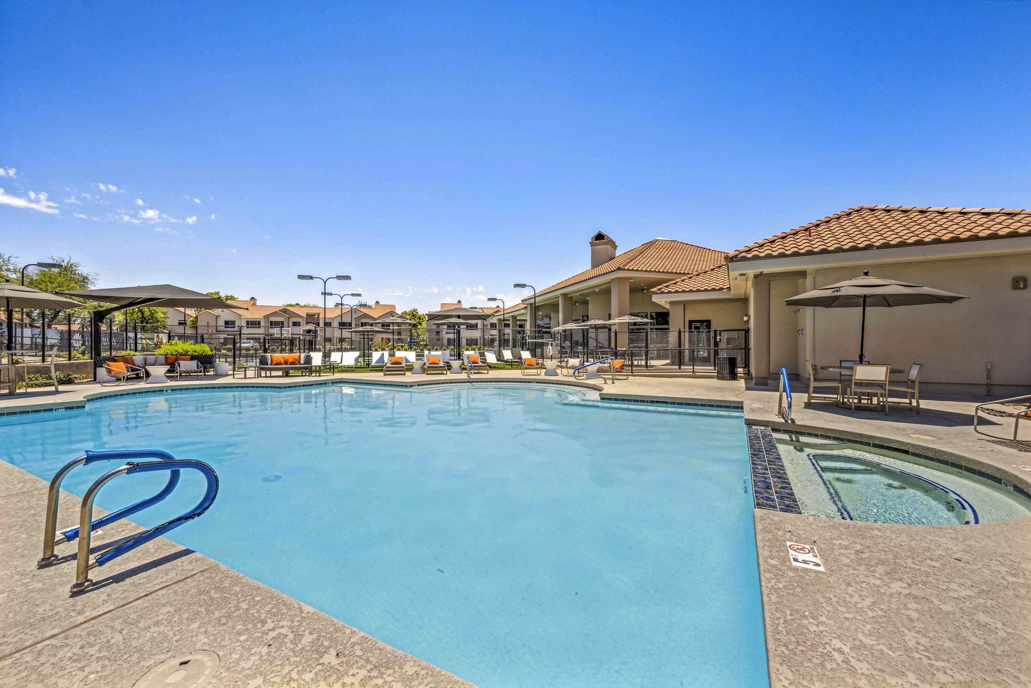 Resort-style pool with sun loungers at Hideaway North Scottsdale Apartments