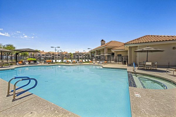 Resort-style pool with sun loungers at Hideaway North Scottsdale Apartments