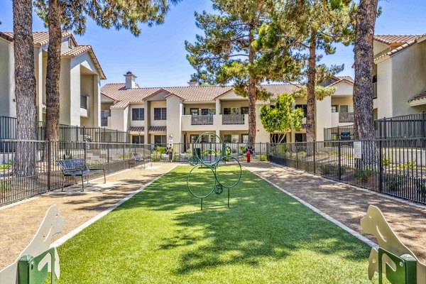 Dog park at Hideaway North Scottsdale Apartments offering spacious play area and agility equipment for pets