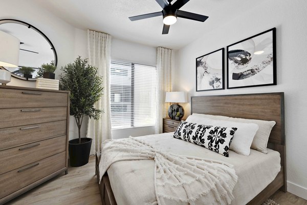 Cozy bedroom with modern decor at Nines at Kierland Apartments
