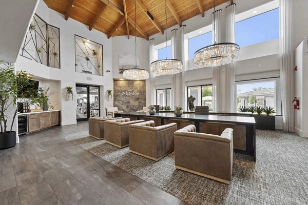 Nines at Kierland Apartments: Elegant clubhouse with modern furnishings and fireplace in our luxury Scottsdale community