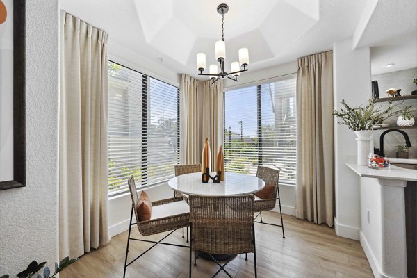 Dining area with modern decor and sleek furniture at Nines at Kierland Apartments