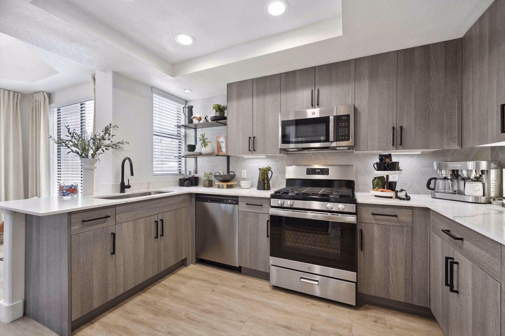Modern kitchen with stainless steel appliances at Nines at Kierland Apartments