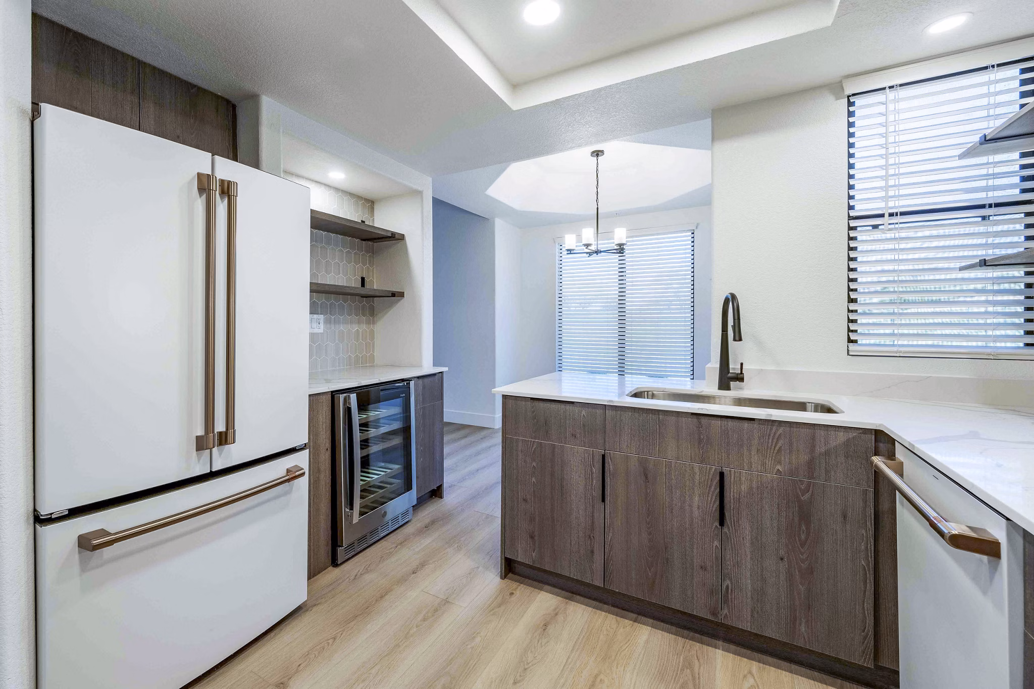 Modern kitchen with granite countertops and stainless steel appliances at Nines at Kierland Apartments
