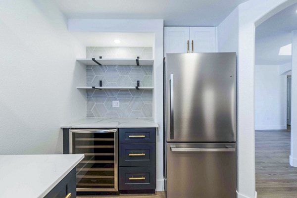 Modern kitchen with stainless steel appliances at Nines at Kierland Apartments