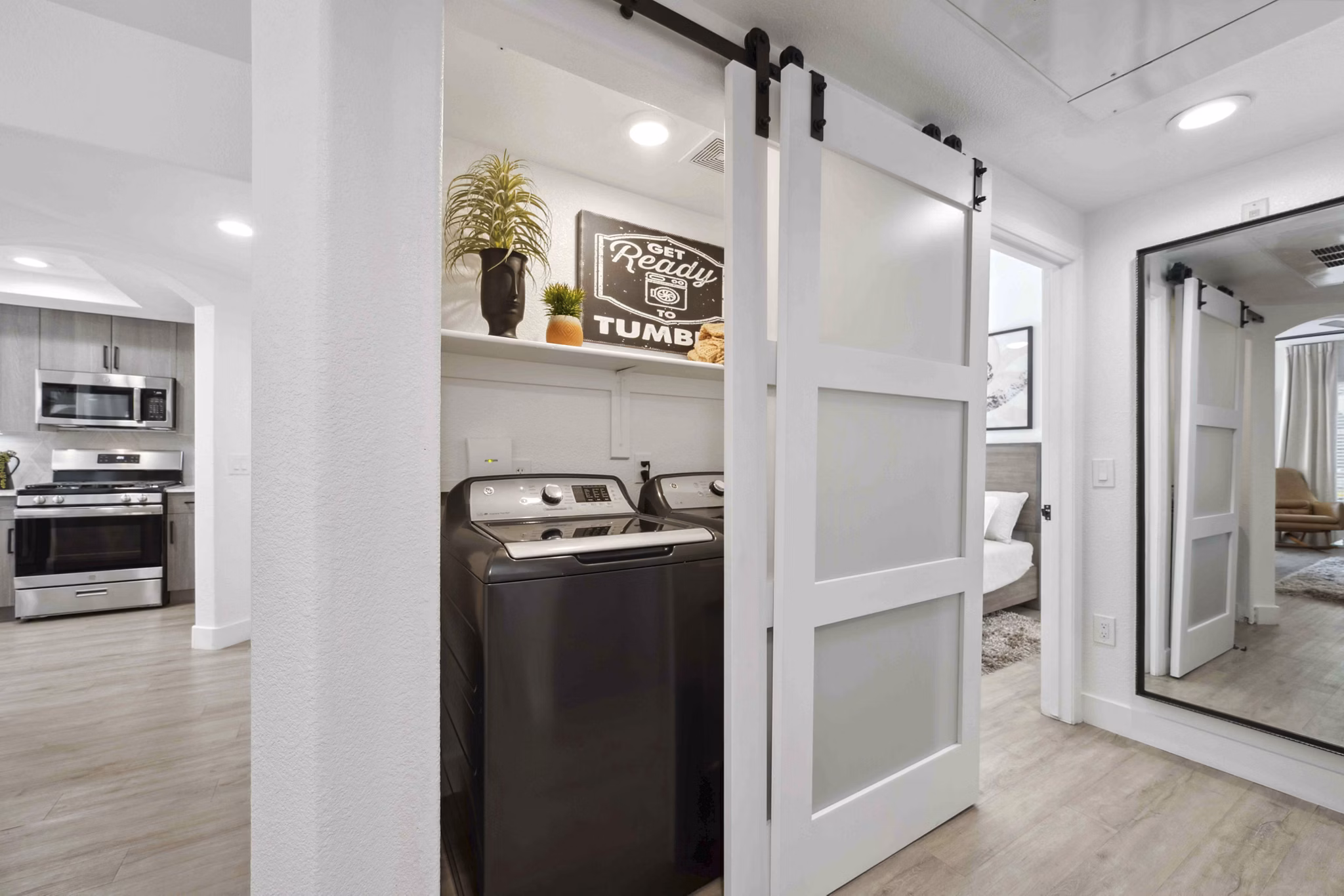 Laundry room with high-efficiency washers and dryers at Nines at Kierland Apartments