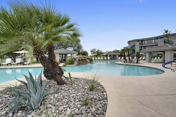 Olympic-size pool at Nines at Kierland Apartments with luxurious seating and water features