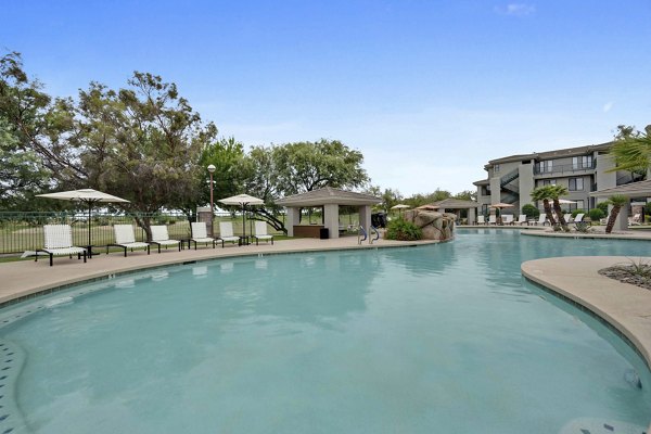 Expansive outdoor pool area at Nines at Kierland Apartments, perfect for relaxation and leisure