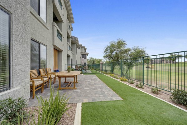 Courtyard featuring lush landscaping and seating areas at Nines at Kierland Apartments