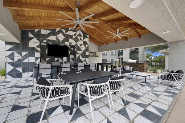 Expansive patio with modern seating and lush greenery at Nines at Kierland Apartments