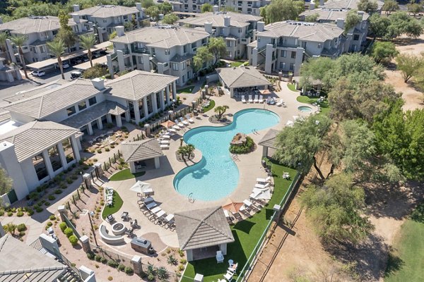 Resort-style pool with sun loungers at Nines at Kierland Apartments