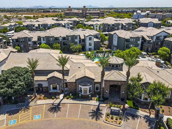 Aerial view of a luxury apartment complex featuring multiple buildings and landscaped areas