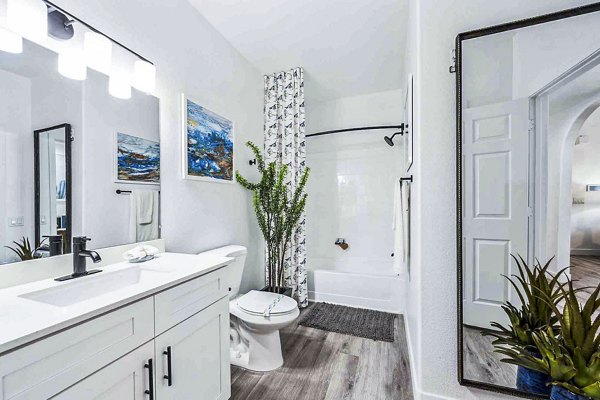 Modern bathroom featuring sleek fixtures and marble countertops in Zone Apartments