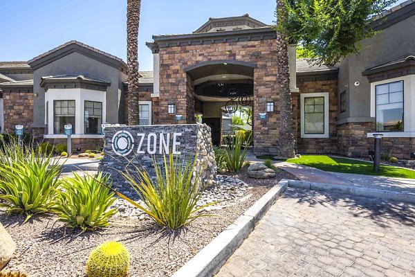 Clubhouse featuring modern lounge areas at Zone Apartments