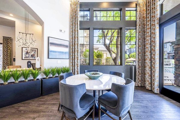 Clubhouse featuring modern design and ample seating at Zone Apartments