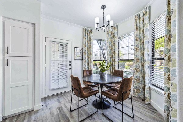 Dining room with modern furnishings at Zone Apartments