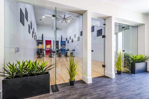 State-of-the-art yoga/spin studio at Zone Apartments, offering fitness amenities for health-conscious residents