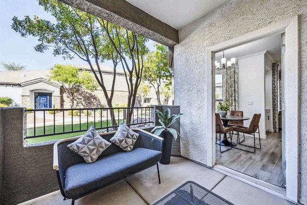 Private patio with outdoor seating at Zone Apartments: Luxury living space for relaxation and leisure