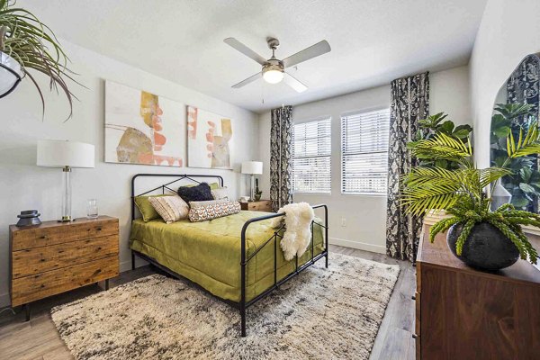 Luxury bedroom with king-sized bed and modern decor at Zone Luxe Apartments