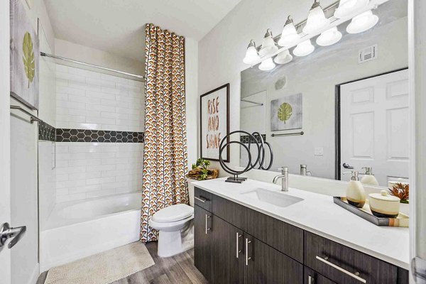 Luxury bathroom with modern fixtures at Zone Luxe Apartments