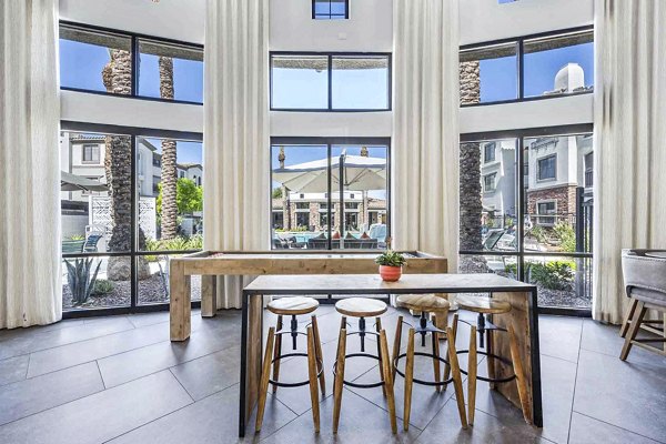 Stylish clubhouse lobby with modern furnishings at Zone Luxe Apartments, creating a welcoming atmosphere for residents and guests