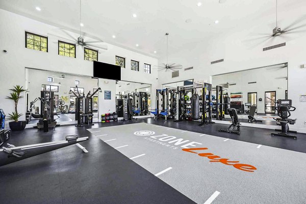 State-of-the-art fitness center with modern equipment at Zone Luxe Apartments