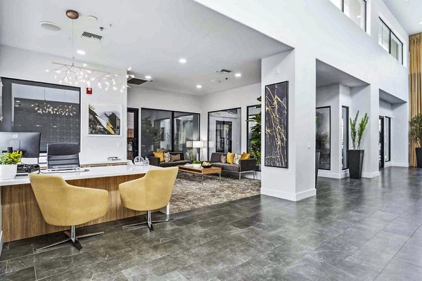 Modern clubhouse and leasing office at Zone Westgate Apartments offering luxury amenities