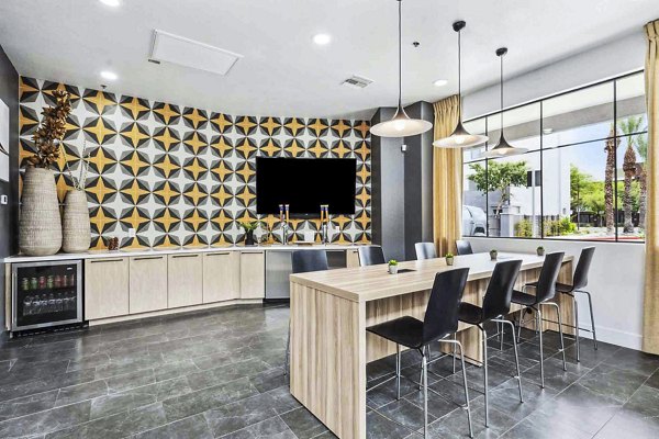 Clubhouse kitchen featuring modern appliances and sleek design at Zone Westgate Apartments