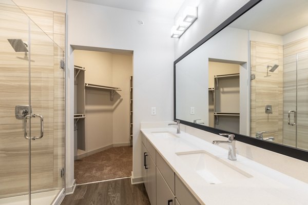 Bathroom with sleek fixtures and modern design at Five810 Southlands Apartments