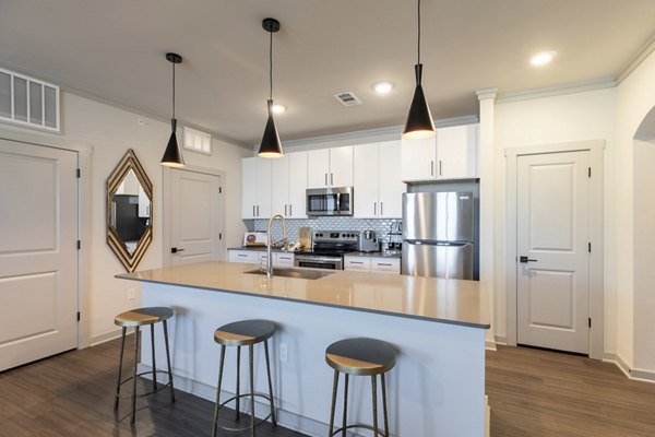 Modern kitchen with stainless steel appliances at Five810 Southlands Apartments, a luxurious Greystar community