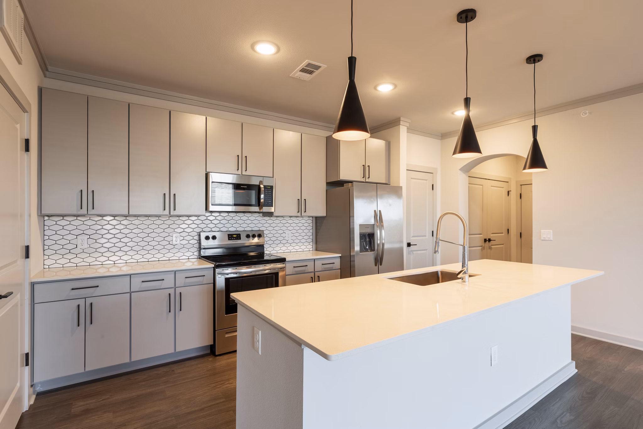 Modern kitchen with stainless steel appliances at Five810 Southlands Apartments