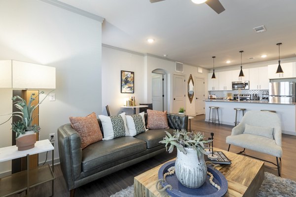 Spacious living room with modern decor at Five810 Southlands Apartments in Aurora, emphasizing luxury living features for residents